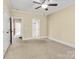 Spacious bedroom showing access to an ensuite bathroom and hallway at 6011 Nw Village Nw Dr, Concord, NC 28027
