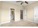 Bedroom with an attached bathroom, with access to the upper floor via a staircase at 6011 Nw Village Nw Dr, Concord, NC 28027