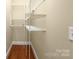 Walk-in closet with shelving for optimal storage and organization in a well-designed home at 6011 Nw Village Nw Dr, Concord, NC 28027