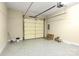 A tidy garage with an epoxy floor and ample storage space at 6011 Nw Village Nw Dr, Concord, NC 28027