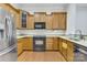 Well-equipped kitchen featuring granite countertops, stainless steel appliances, and ample cabinet space at 6011 Nw Village Nw Dr, Concord, NC 28027