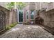 Private brick patio offers a cozy outdoor space for relaxing or entertaining in this brick townhome at 6011 Nw Village Nw Dr, Concord, NC 28027