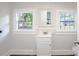 Charming bathroom with a vanity, mirror, and two windows providing great natural light at 615 & 625 Irish Potato Rd, Concord, NC 28025