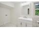 Bathroom featuring a modern sink, mirror and vanity with great natural light at 615 & 625 Irish Potato Rd, Concord, NC 28025