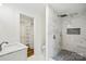 Modern bathroom features a rainfall shower head, mosaic tile accents, and a sleek design at 615 & 625 Irish Potato Rd, Concord, NC 28025