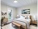 Staged bedroom featuring a comfortable bed, stylish decor, and ample natural light from a large window at 615 & 625 Irish Potato Rd, Concord, NC 28025