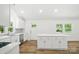 Bright modern kitchen featuring an island with quartz countertop, stainless steel appliances at 615 & 625 Irish Potato Rd, Concord, NC 28025