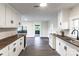 Bright kitchen featuring white cabinets, wood countertops, and an open floor plan to the dining area at 615 & 625 Irish Potato Rd, Concord, NC 28025