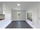 Bright interior with plank flooring, and a window offering a view of the surrounding land at 615 & 625 Irish Potato Rd, Concord, NC 28025