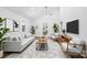 Living room with neutral décor, modern furniture, and open view to a dining space at 615 & 625 Irish Potato Rd, Concord, NC 28025