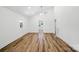 Bright living room with hardwood floors, white walls, and a modern ceiling fan at 615 & 625 Irish Potato Rd, Concord, NC 28025