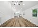 Open concept living space with hardwood flooring and a view of the bright, white kitchen at 615 & 625 Irish Potato Rd, Concord, NC 28025