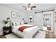 Stylish main bedroom boasts a ceiling fan and sliding door to a modern bathroom at 615 & 625 Irish Potato Rd, Concord, NC 28025