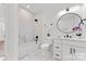 Stylish bathroom featuring marble tile, modern fixtures, and a shower-tub combination with sleek design at 621 Poindexter Dr, Charlotte, NC 28209