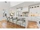 Spacious kitchen with an oversized island with seating, white cabinetry, and stainless steel appliances at 621 Poindexter Dr, Charlotte, NC 28209