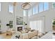 Bright living room with large windows, a stylish fireplace, high ceilings, and modern accents at 621 Poindexter Dr, Charlotte, NC 28209