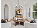 Inviting living room with large windows, neutral colors, and modern furnishings at 621 Poindexter Dr, Charlotte, NC 28209