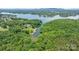Beautiful aerial photograph of the property reveals its prime location near a lake and mature trees at 6256 Monford Dr, Conover, NC 28613