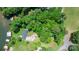 A birds-eye view of lake property showing boundaries with mature trees and lake access with private docks at 6256 Monford Dr, Conover, NC 28613