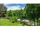 Backyard view featuring a treelined lake with two small boat houses at 6256 Monford Dr, Conover, NC 28613