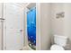 Bathroom featuring a toilet and a shower with a blue curtain at 6256 Monford Dr, Conover, NC 28613