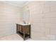 A bathroom with a modern vanity, tiled floor, and neutral color palette creates a clean and functional space at 6256 Monford Dr, Conover, NC 28613