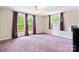 Bright bedroom with French doors leading to a balcony, offering a private retreat with outdoor access at 6256 Monford Dr, Conover, NC 28613