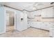 Bright kitchen featuring white cabinets, appliances, and a breakfast bar, offers a functional space for culinary creations at 6256 Monford Dr, Conover, NC 28613