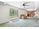 The living room boasts a sliding glass door to the patio, a stone wall and direct access to the backyard at 6256 Monford Dr, Conover, NC 28613