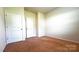 This is a bedroom that has two doors and carpet flooring and great lighting at 640 Yellow Birch Dr, Locust, NC 28097