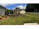 Welcoming entrance to the Crossroads community featuring a brick sign and beautiful landscaping at 640 Yellow Birch Dr, Locust, NC 28097