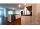 Spacious kitchen featuring stainless steel appliances, granite countertops and dark hardwood floors at 640 Yellow Birch Dr, Locust, NC 28097