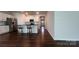 Kitchen view featuring stainless steel appliances, white cabinetry and hardwood floors at 640 Yellow Birch Dr, Locust, NC 28097