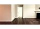 Cozy living room features a classic fireplace and dark hardwood floors with easy access at 640 Yellow Birch Dr, Locust, NC 28097