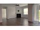 The living room features a fireplace, fan, hardwood floors, and access to a slider door at 640 Yellow Birch Dr, Locust, NC 28097
