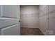 Functional walk-in closet with full view of adjustable shelving and neutral carpet at 640 Yellow Birch Dr, Locust, NC 28097