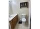 This bathroom features a sink with wooden cabinets and an open shower at 667 Blossom Hill Rd, Lincolnton, NC 28092