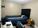 This bedroom features a bed with a blue cover and matching furniture at 667 Blossom Hill Rd, Lincolnton, NC 28092