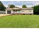 Charming ranch home with a well-manicured lawn and inviting curb appeal at 667 Blossom Hill Rd, Lincolnton, NC 28092