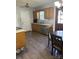 This kitchen features natural wood cabinets, stainless appliances, and an eat-in dining area at 667 Blossom Hill Rd, Lincolnton, NC 28092