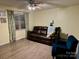 This living room has a large sofa and decorative window curtains at 667 Blossom Hill Rd, Lincolnton, NC 28092
