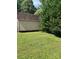 View of storage shed at edge of lot with lawn at 667 Blossom Hill Rd, Lincolnton, NC 28092