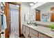 Well-lit bathroom featuring a vanity, framed mirror, and a shower at 7204 E 218 Hwy, Marshville, NC 28103