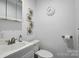 Bright bathroom featuring a white vanity, decorative accents, and essential fixtures at 7204 E 218 Hwy, Marshville, NC 28103
