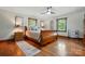 Comfortable bedroom features hardwood floors, natural lighting, and a ceiling fan at 7204 E 218 Hwy, Marshville, NC 28103