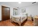 Cozy bedroom with a bed, hardwood floors, and a light color scheme at 7204 E 218 Hwy, Marshville, NC 28103