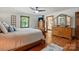 Spacious bedroom with hardwood floors, a ceiling fan and natural light at 7204 E 218 Hwy, Marshville, NC 28103