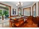 Sunny dining room with hardwood floors, natural light, and classic chandelier at 7204 E 218 Hwy, Marshville, NC 28103