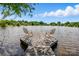 Beautiful waterfront view with a charming dock featuring chairs for relaxation, perfect for enjoying the serene lake at 7204 E 218 Hwy, Marshville, NC 28103