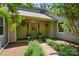 Inviting front entrance with manicured landscaping, hanging plants, and a welcoming wreath on the front door at 7204 E 218 Hwy, Marshville, NC 28103